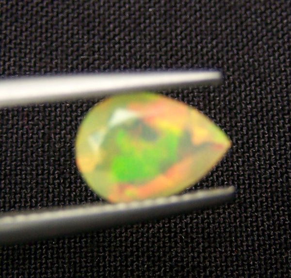 0.90 cts Insane Metallic Rainbow Fire Color Play Ethiopian Welo Opal Faceted Pear 7 x 10 MM > Loose Gemstone > AAA