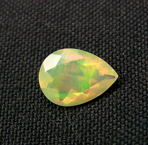 0.90 cts Insane Metallic Rainbow Fire Color Play Ethiopian Welo Opal Faceted Pear 7 x 10 MM > Loose Gemstone > AAA