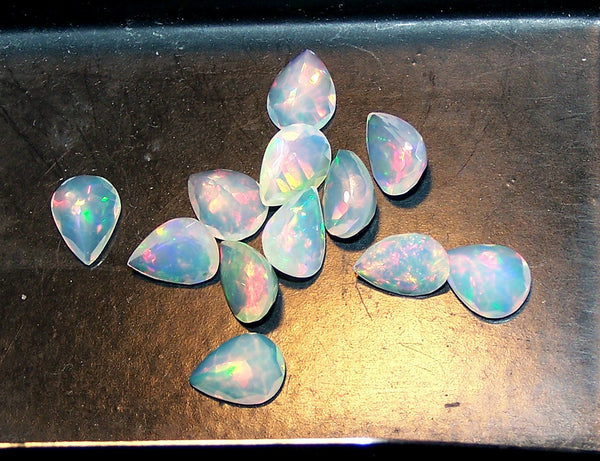 7.50 cts Insane Metallic Rainbow Fire Color Play Ethiopian Welo Opal Faceted 6 x 8 MM Pears : 12 Pcs Loose Gemstone Lot/Parcel > AAA