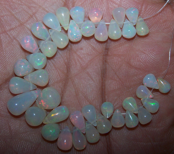34.90 cts Multi Rainbow Fire Milky Ethiopian Welo Opal Tear Drops (40 Pcs) Beads Layout 4.5 x 6.5 to 13.5 MM