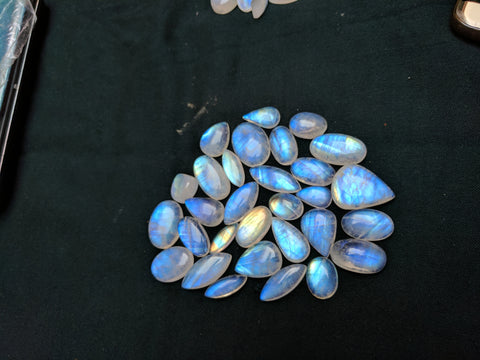 506.35 Cts Fine Quality of White Rainbow Moonstone Mix shaped smooth cabochons Wholesale Sample lot / parcel, 30 Pieces